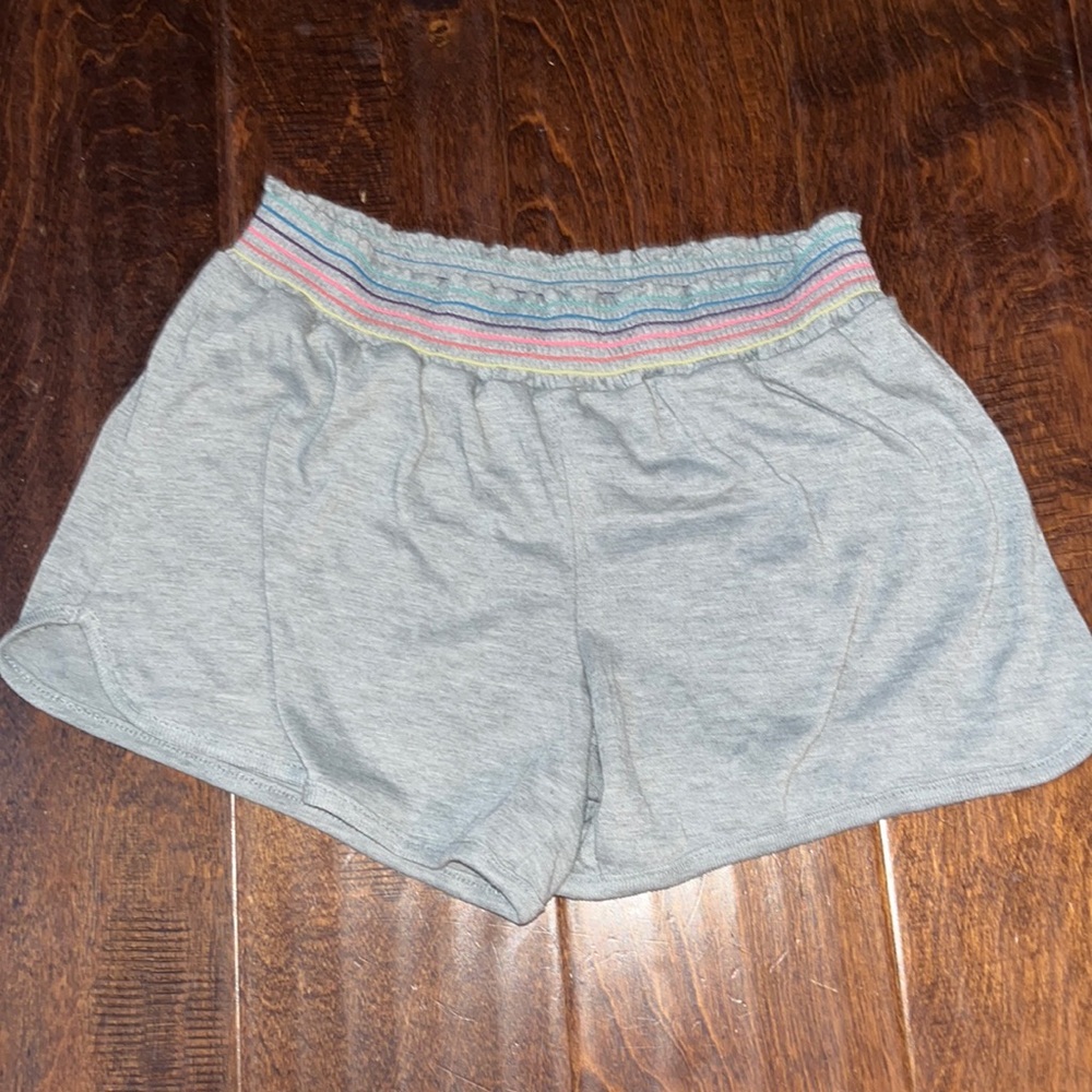 Grey shorts with rainbow on band
